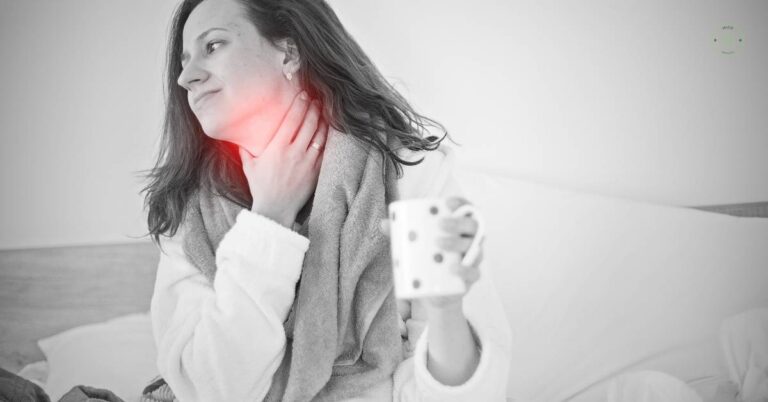 a pregnant person holding a thermometer while clutching their neck, showing discomfort from throat pain