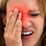 a person holding their eye area in discomfort, showing signs of eye strain or irritation, possibly related to suchost očí