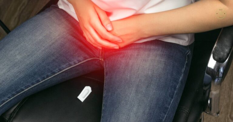 a person holding their left groin area indicating pain or discomfort in the tříslo region, highlighted with a red glow.