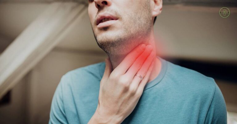 a person holding their neck with highlighted area indicating painful swollen lymph nodes in the throat region.