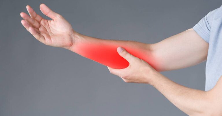 a person holding their forearm with highlighted area indicating pain or discomfort in the front part near the elbow, illustrating common forearm muscle or tendon strain.